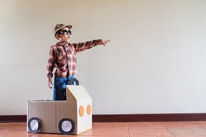 Child in toy box car